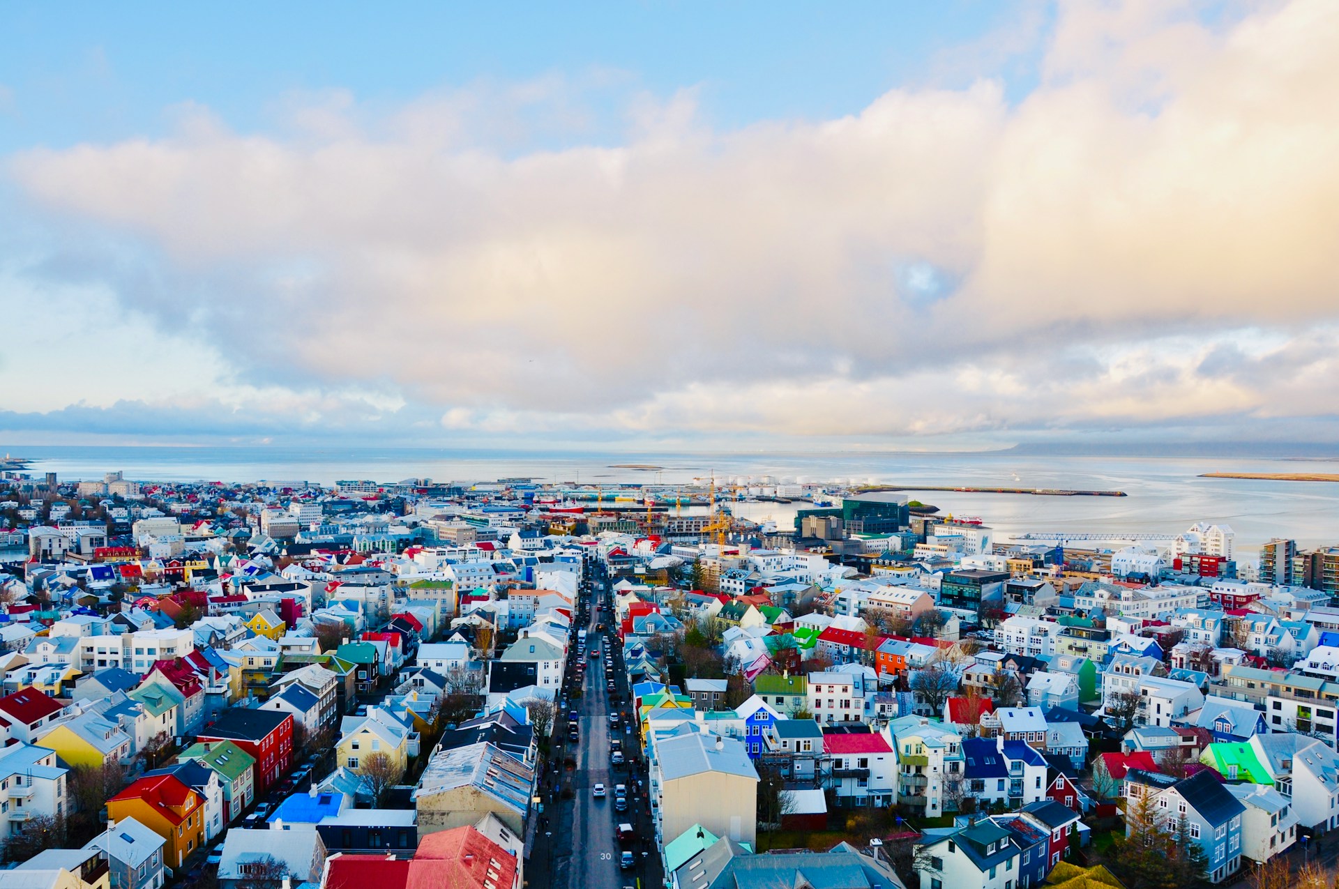 Aerial view of Reykjavik city center with colorful rooftops, Faxaflói Bay, and the Old Harbor in Iceland.&nbsp;