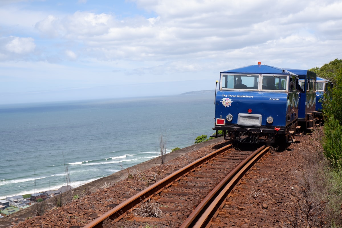 Trenitalia regional train running along the Cinque Terre coast on the Ligurian Sea, the only way to hop between villages