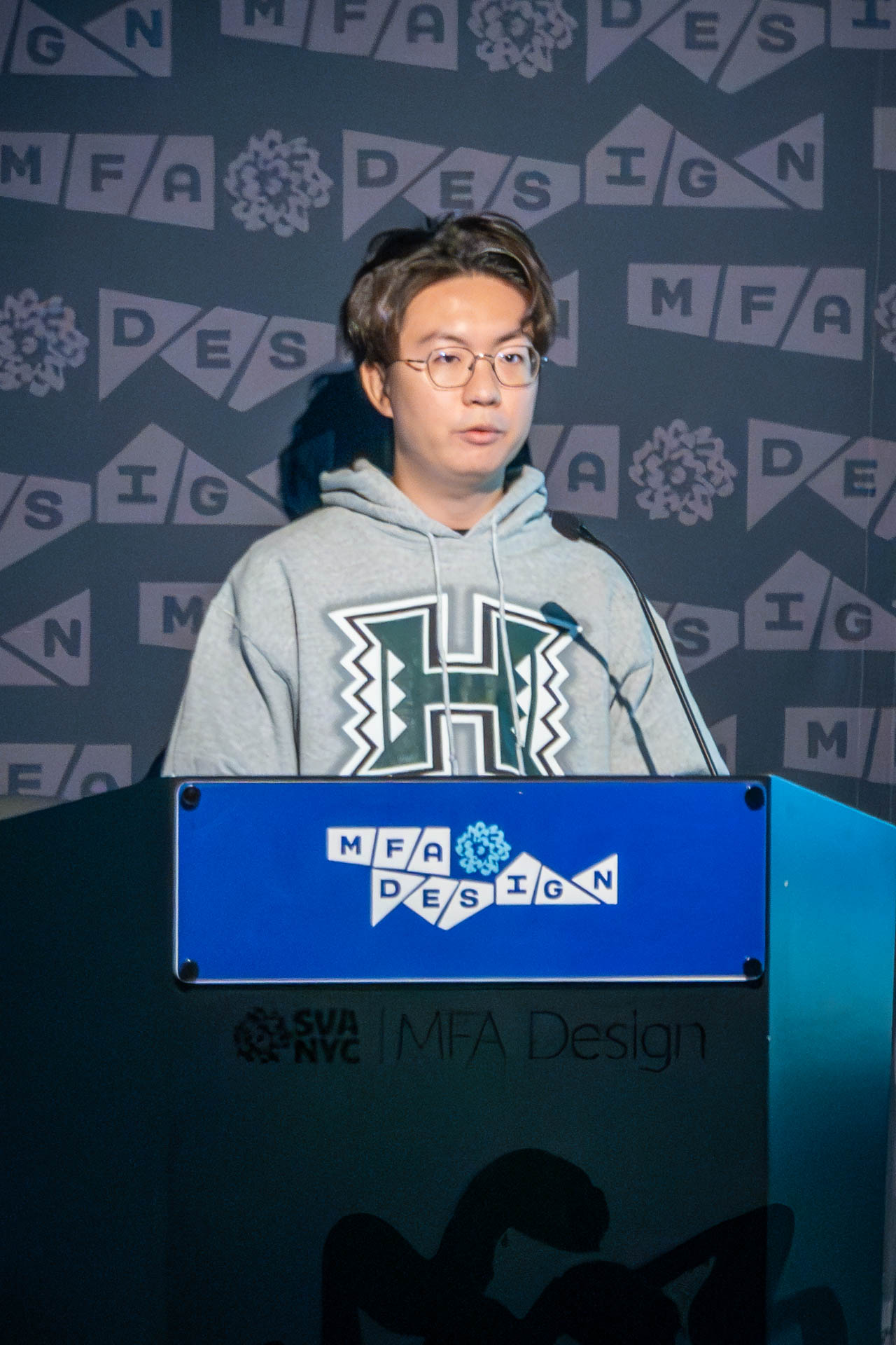 student at a podium giving a presentation