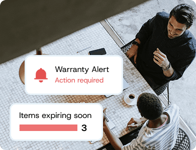 Team reviewing equipment data with a notification showing “Warranty Alert – Items expiring soon,” symbolising proactive warranty management.