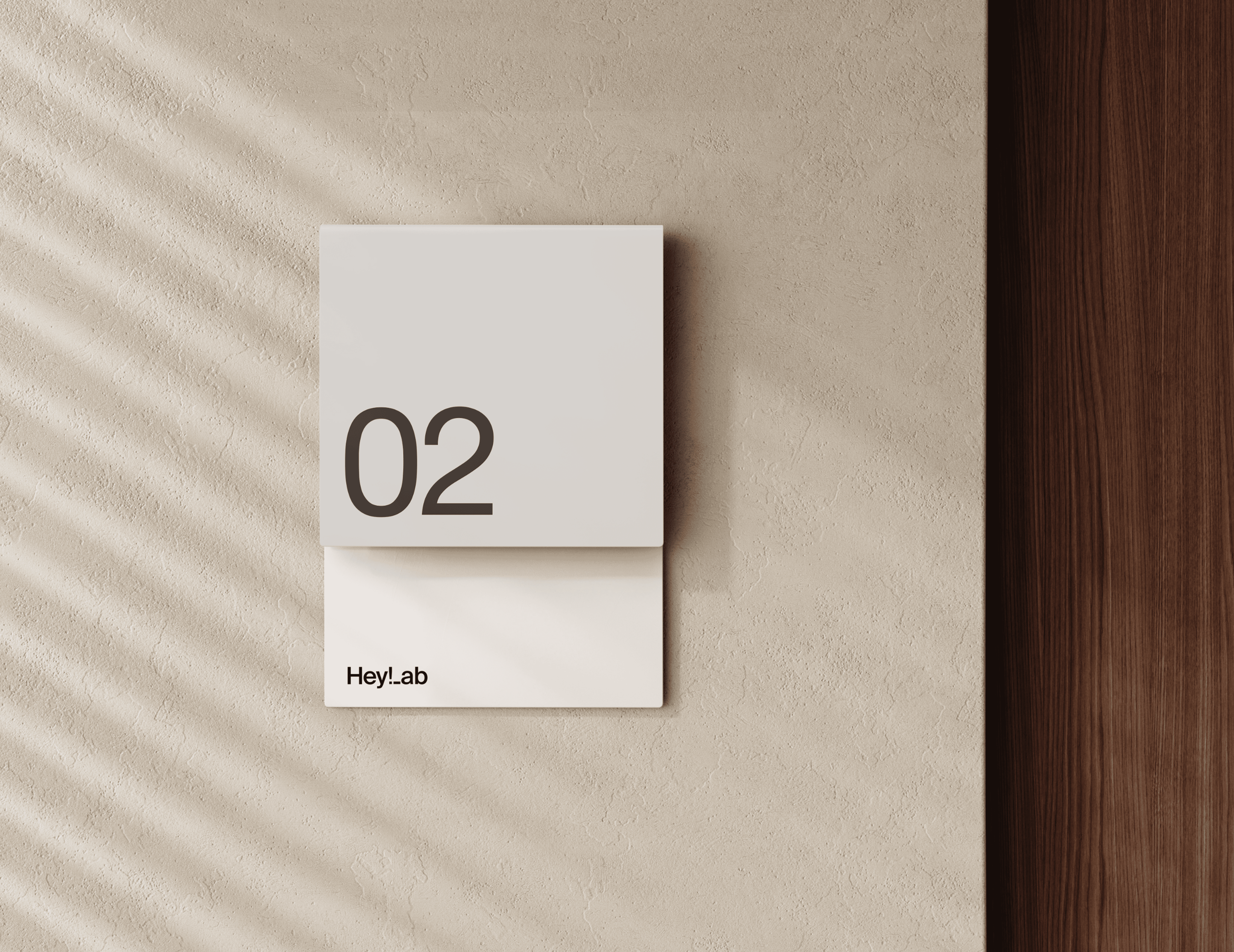 A man working on his computer in a dimly lit office space.