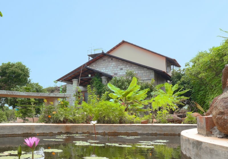 A flower-filled ring floats in fluffy clouds.
