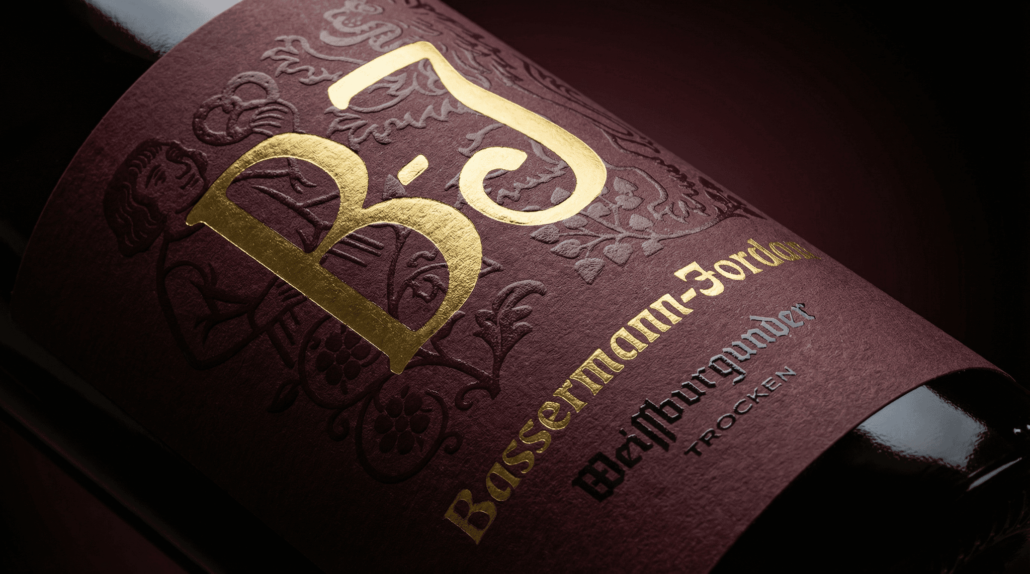 Sunlight streams through a foggy forest with autumn leaves.