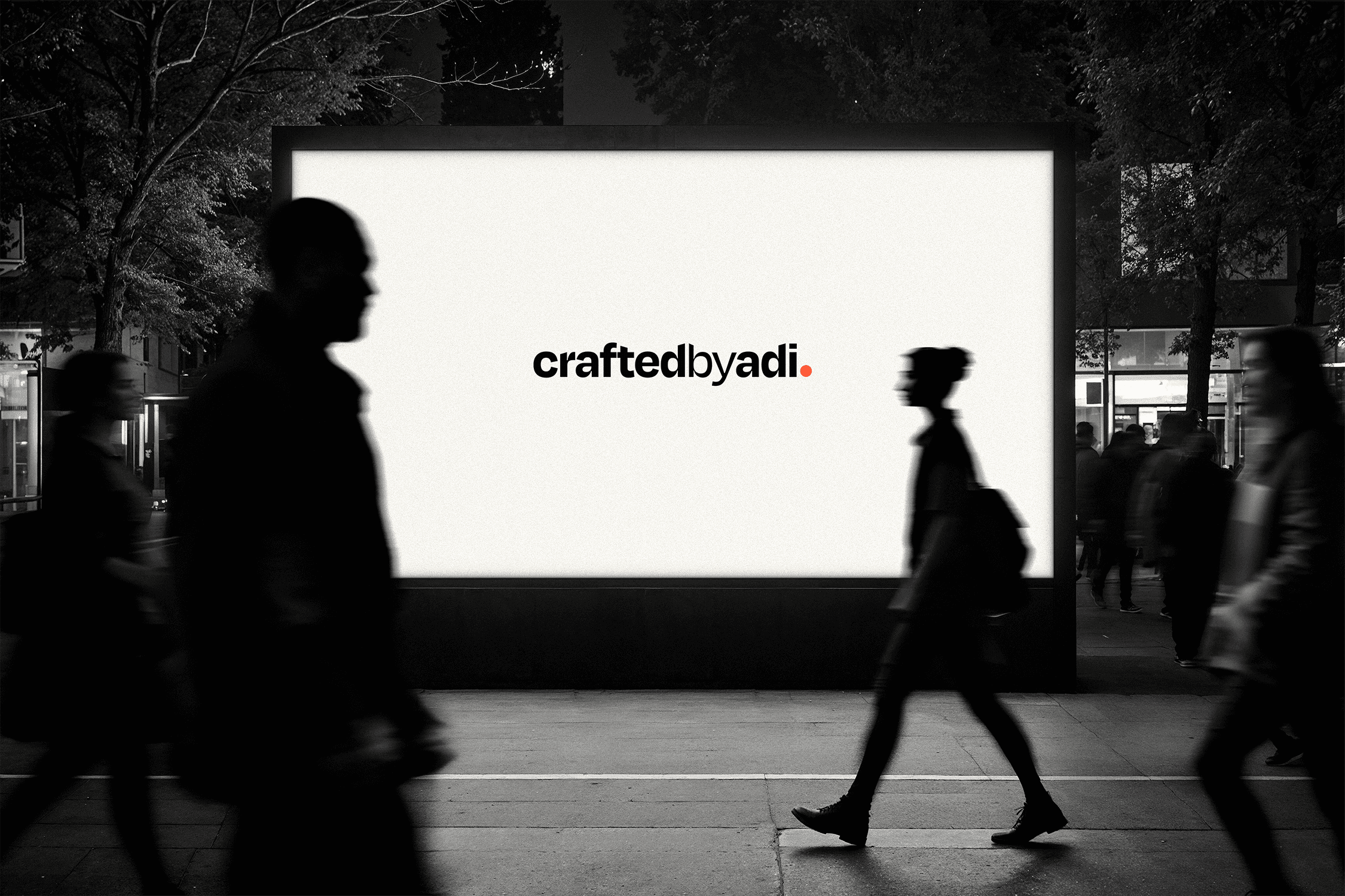 A large glowing white street lightbox displaying the black 'craftedbyadi' wordmark with a coral period, situated in a high-traffic urban evening setting with blurred pedestrians.