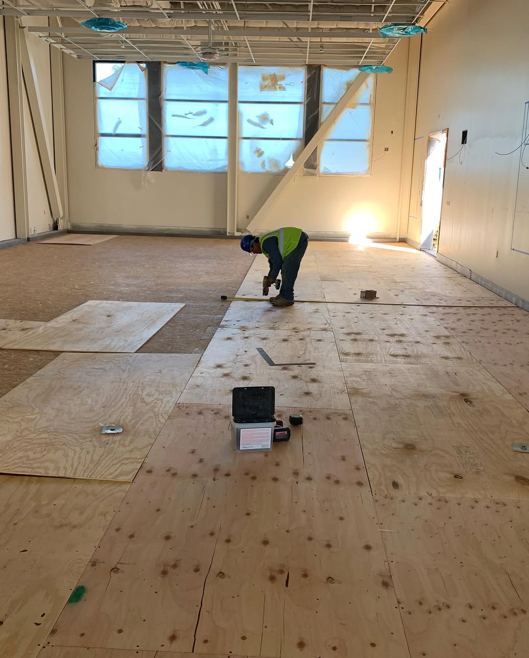 Underlayment fastened down across the room