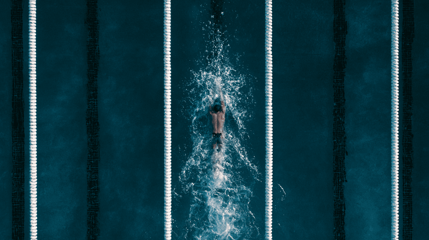 Swimmer inside a pool top view
