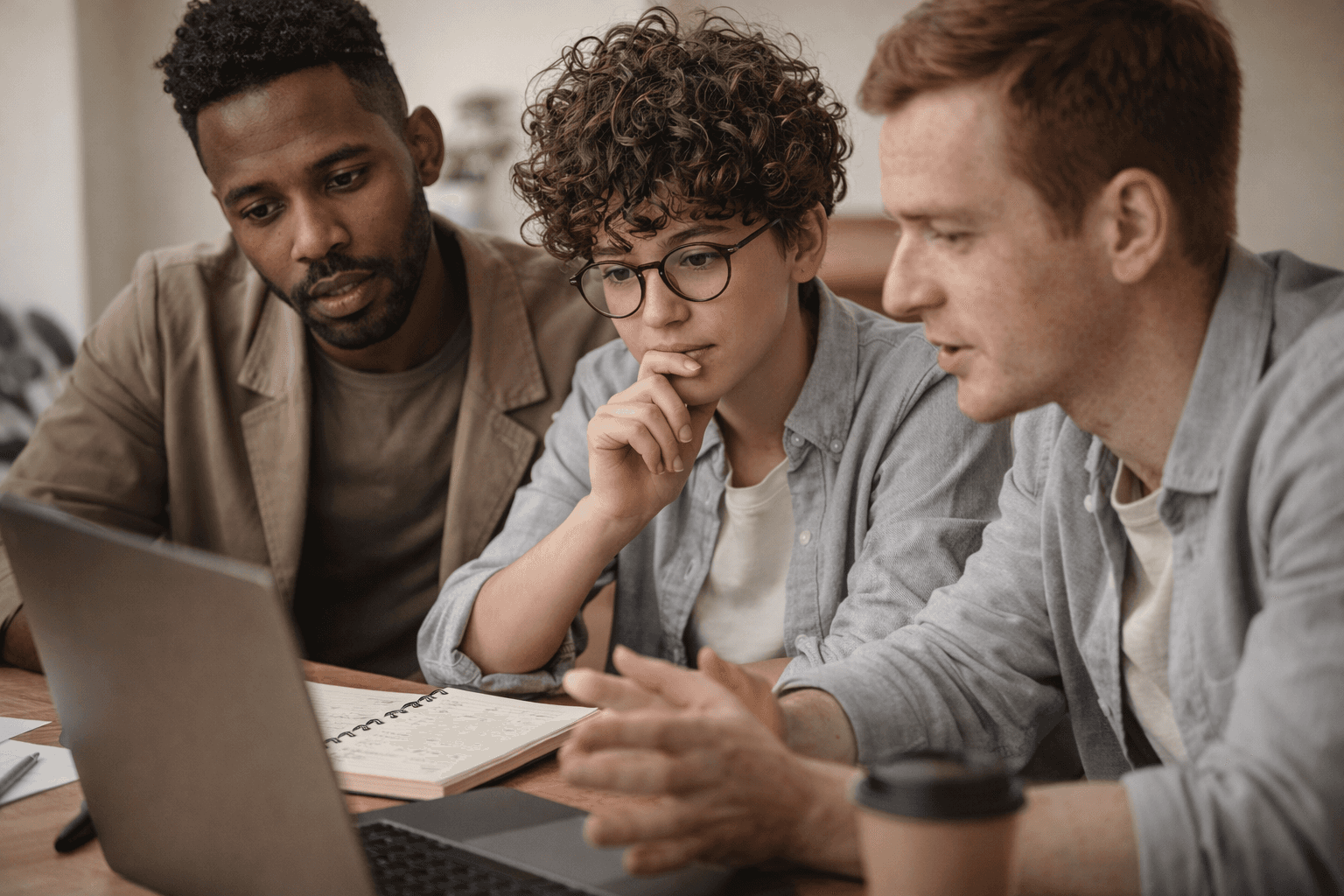 Hands working on a device or document, representing professional results delivered to clients.