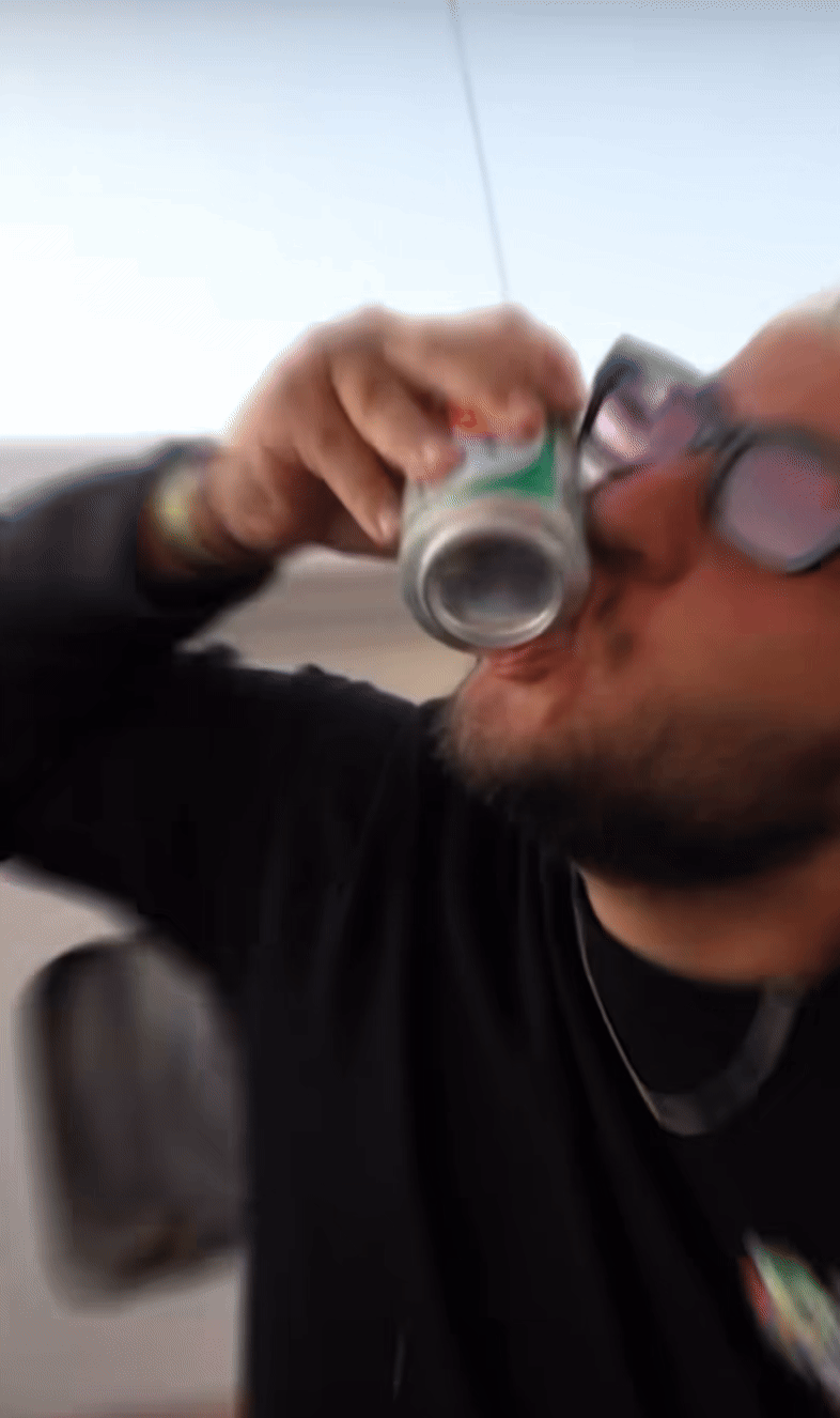 Couple sitting with hot air balloons at sunset