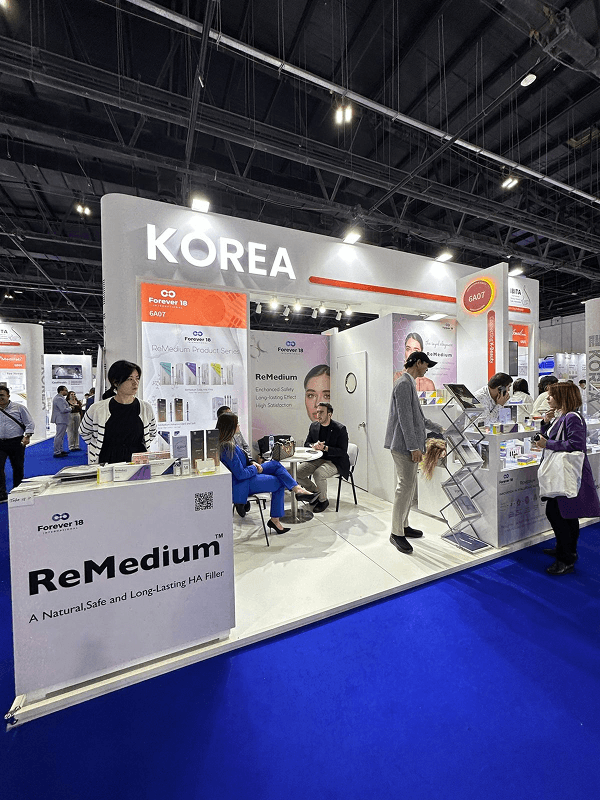 a group of people standing around a booth