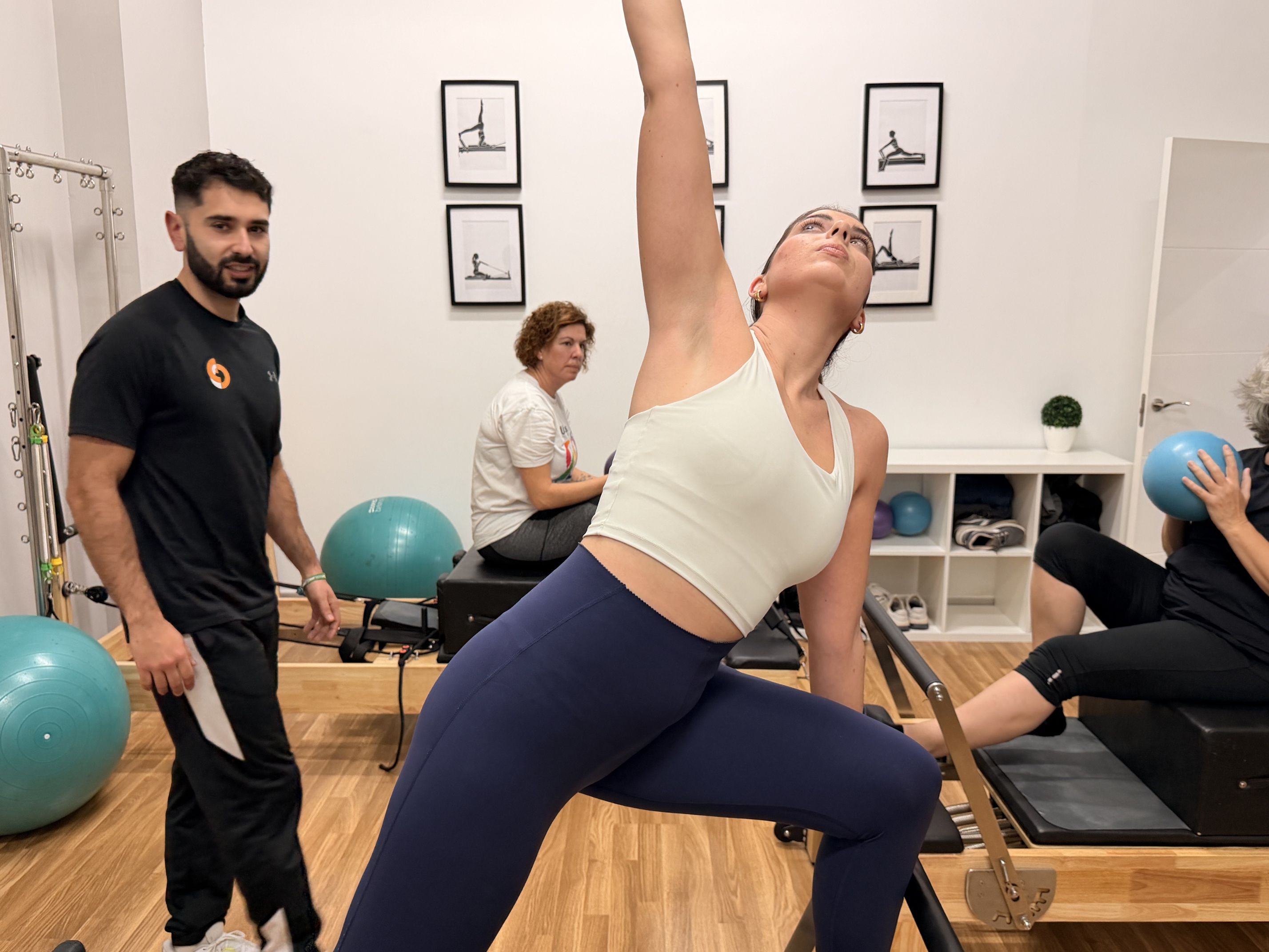 man in black shorts and black tank top doing push up