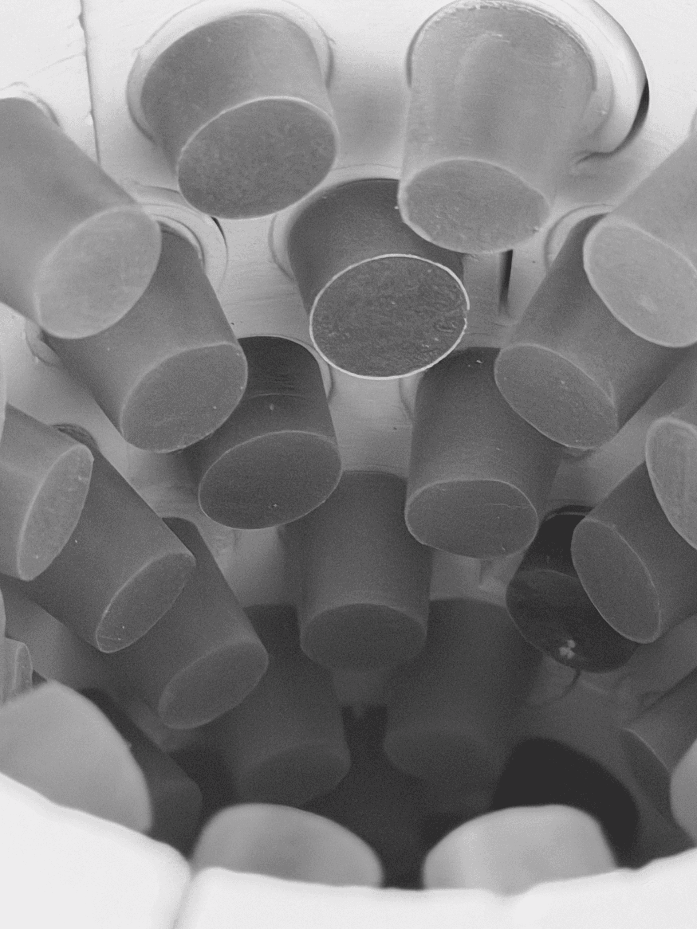 Batch.Works logo over a photo of a box of 3D printed objects