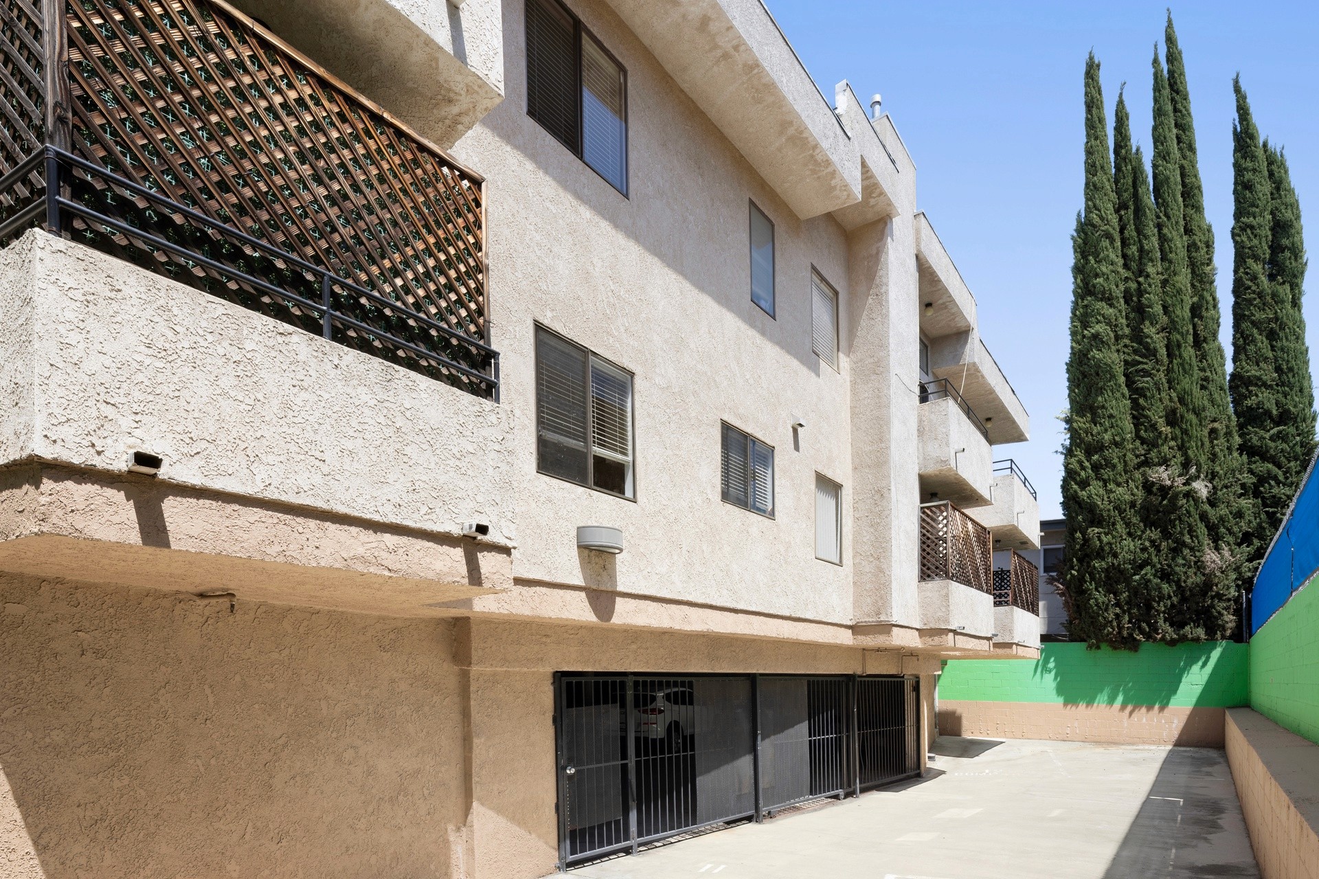 Side parking and gated storage area at 18620 burbank blvd in Tarzana.