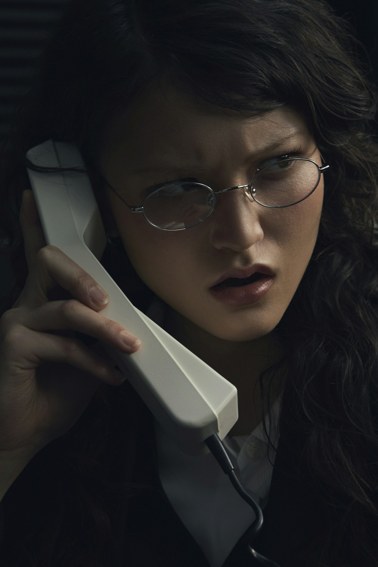 A woman talking on a telephone call.