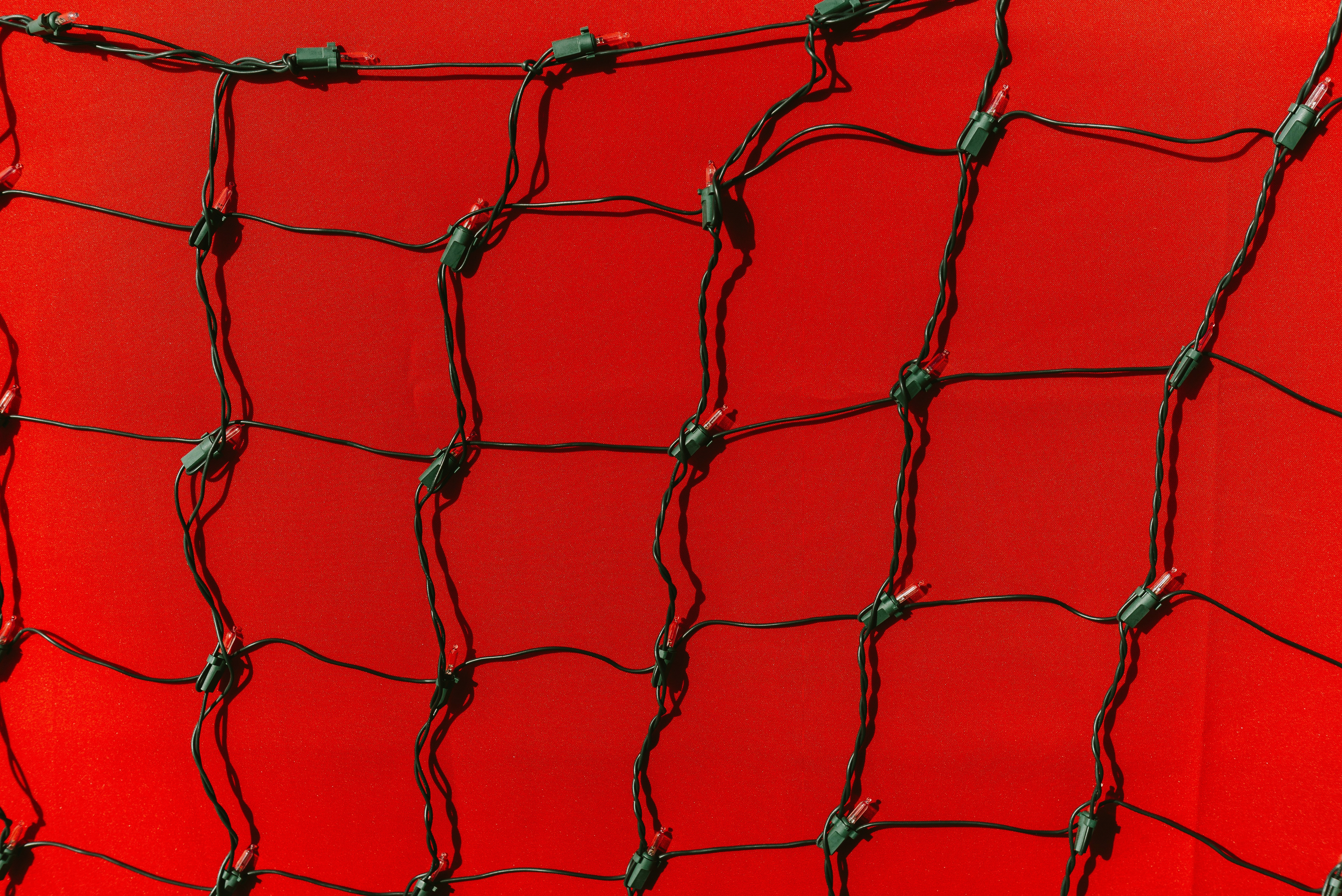 Green net against a bright red background.