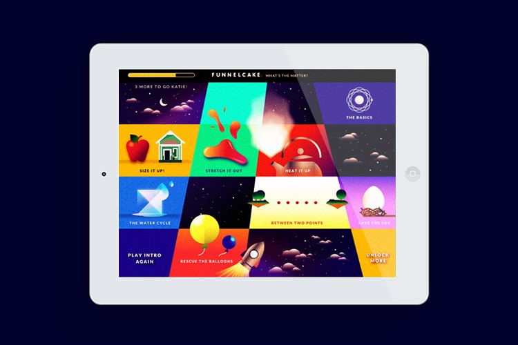 A white tablet displays a grid of colorful, square tiles. Each tile contains an icon and text, including phrases like “3 MORE TO GO KATIE!,” “STRETCH IT OUT,” “HEAT IT UP,” “BETWEEN TWO POINTS,” and “UNLOCK MORE.” The background is dark blue, and the tablet has a circular home button in the bottom right corner.