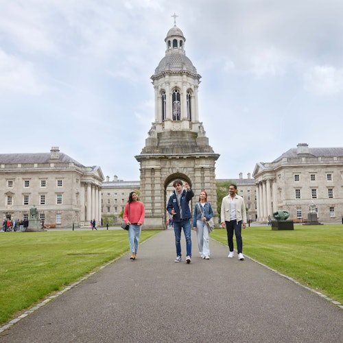 group walking with Campanile in the background