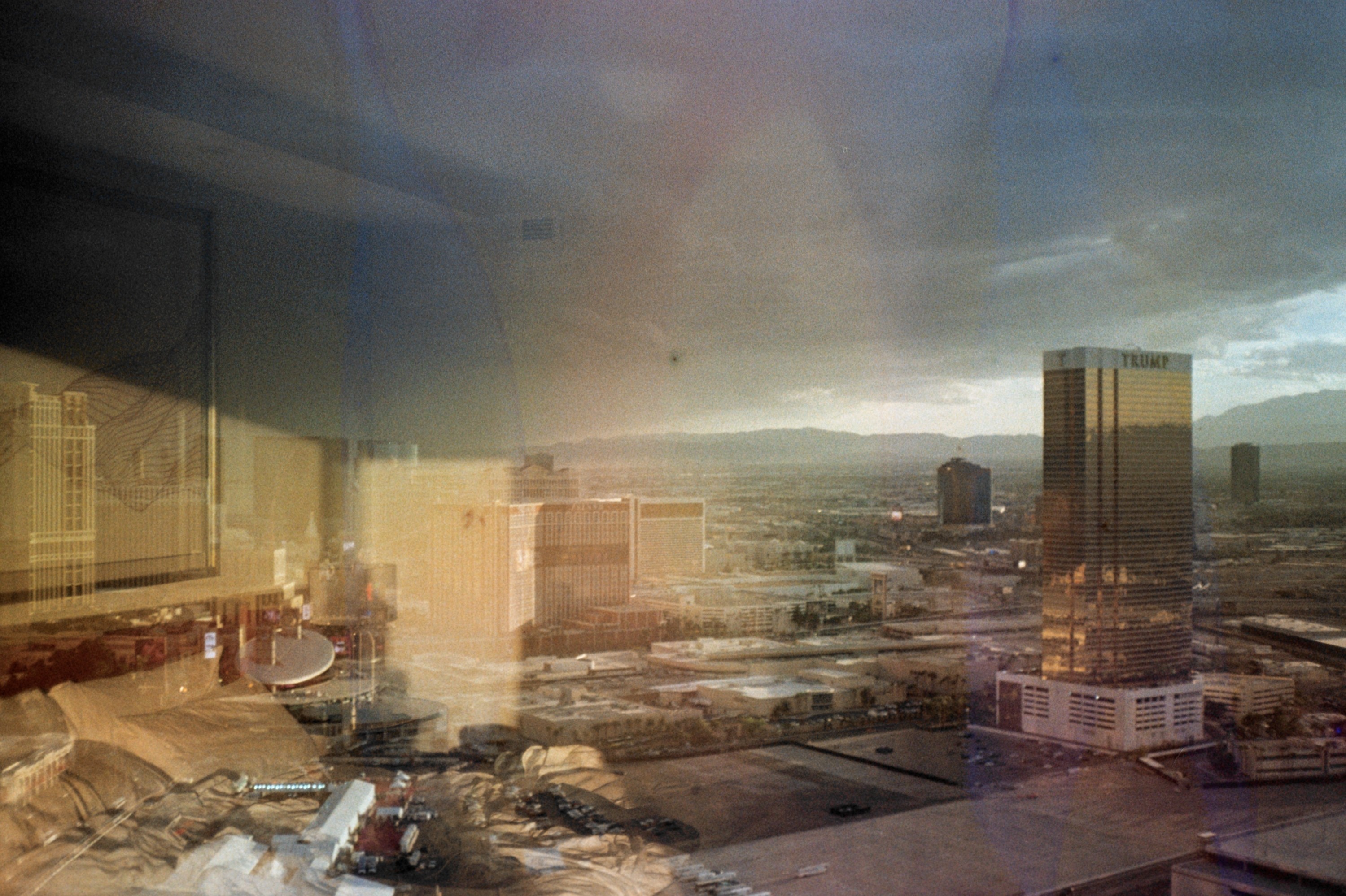 Creative portrait with geometric pink eyewear and bold fashion styling in urban setting