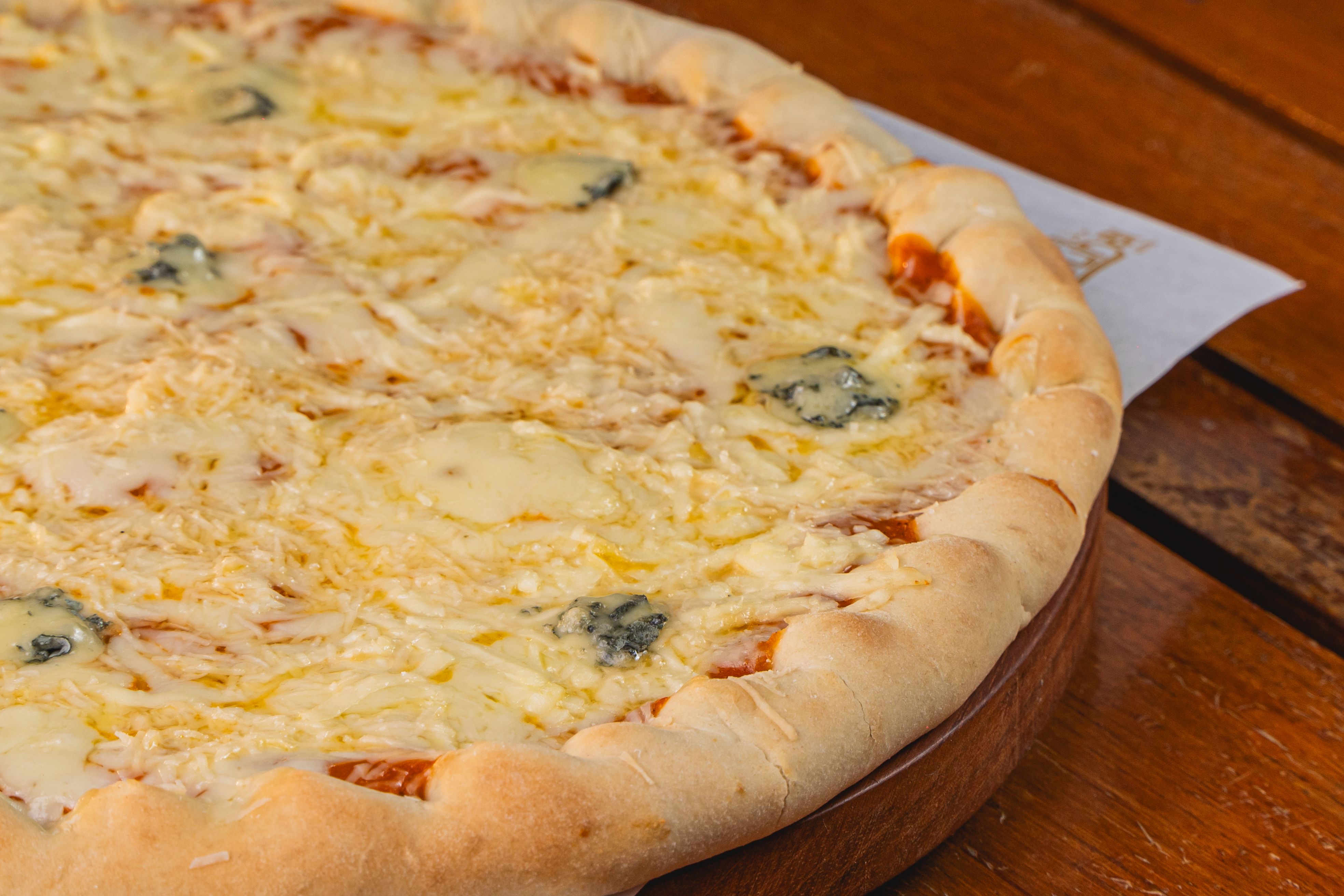 Four cheeses on a crisp white base, no tomato