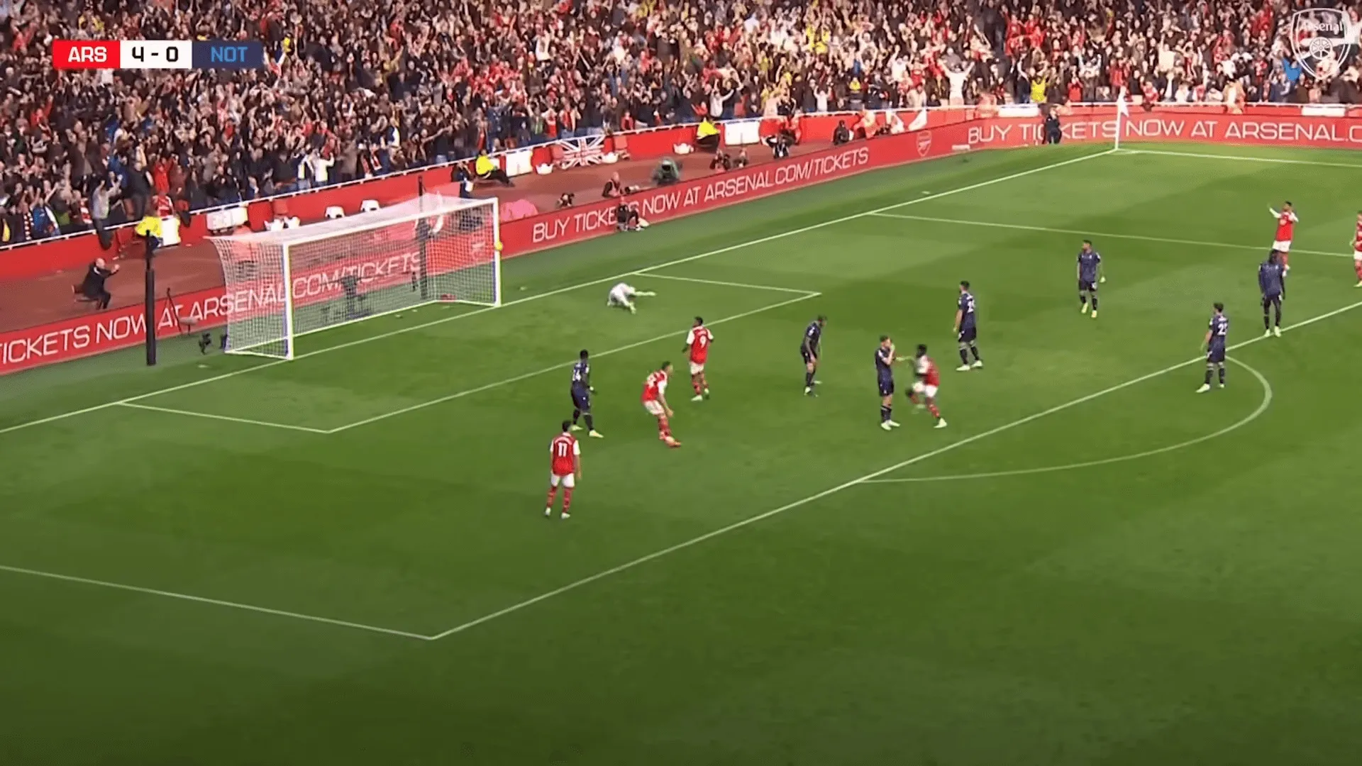 Arsenal FC playing at a filled stadium