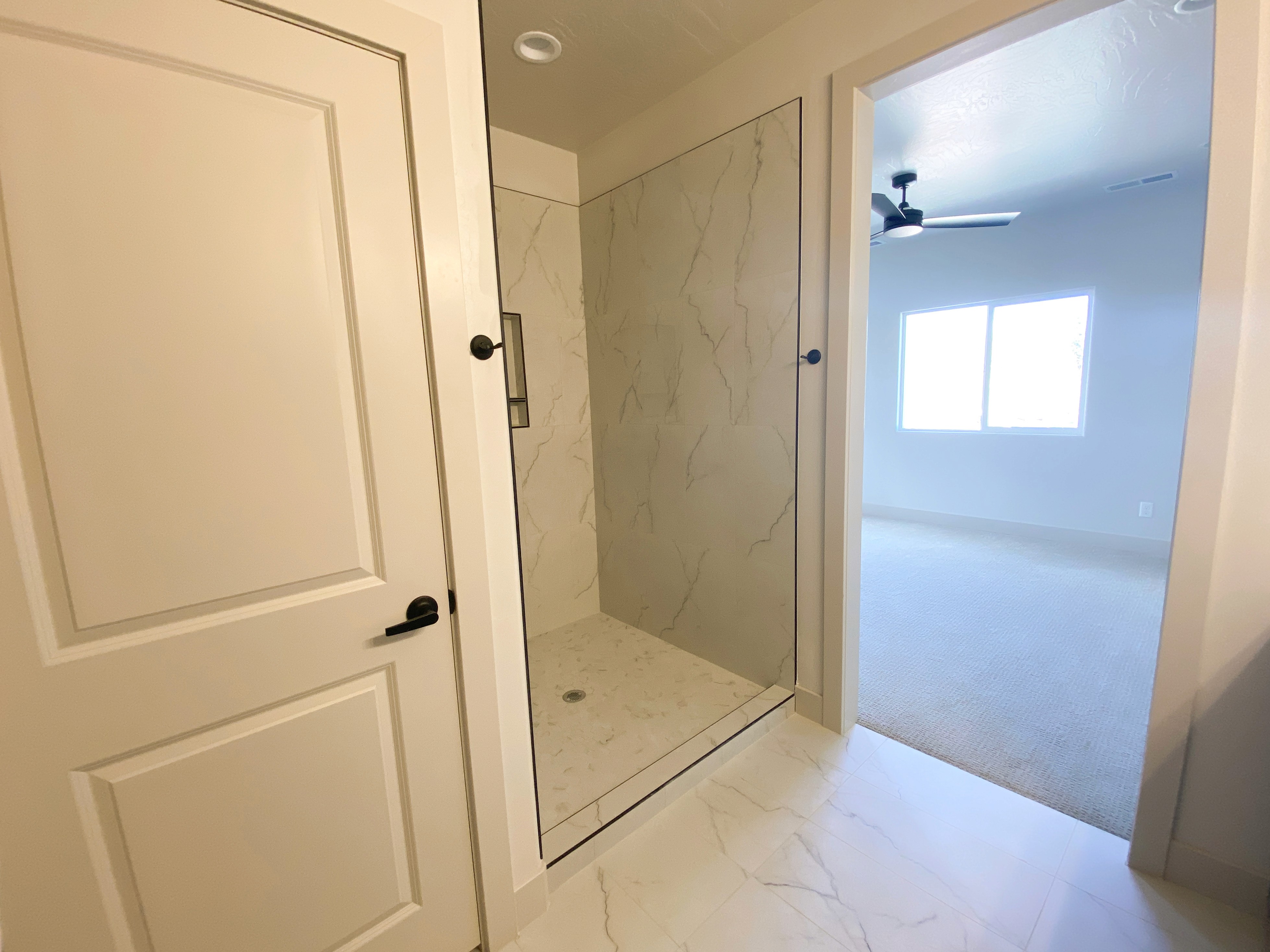 Duplex bathroom with modern fixtures and efficient design in Hurricane, Utah.