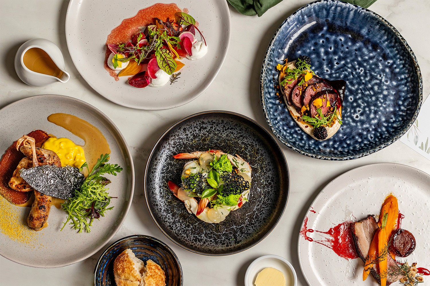 Various Entree dishes shown in a flat-lay