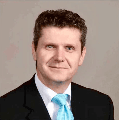 person sitting in a chair in front of a man