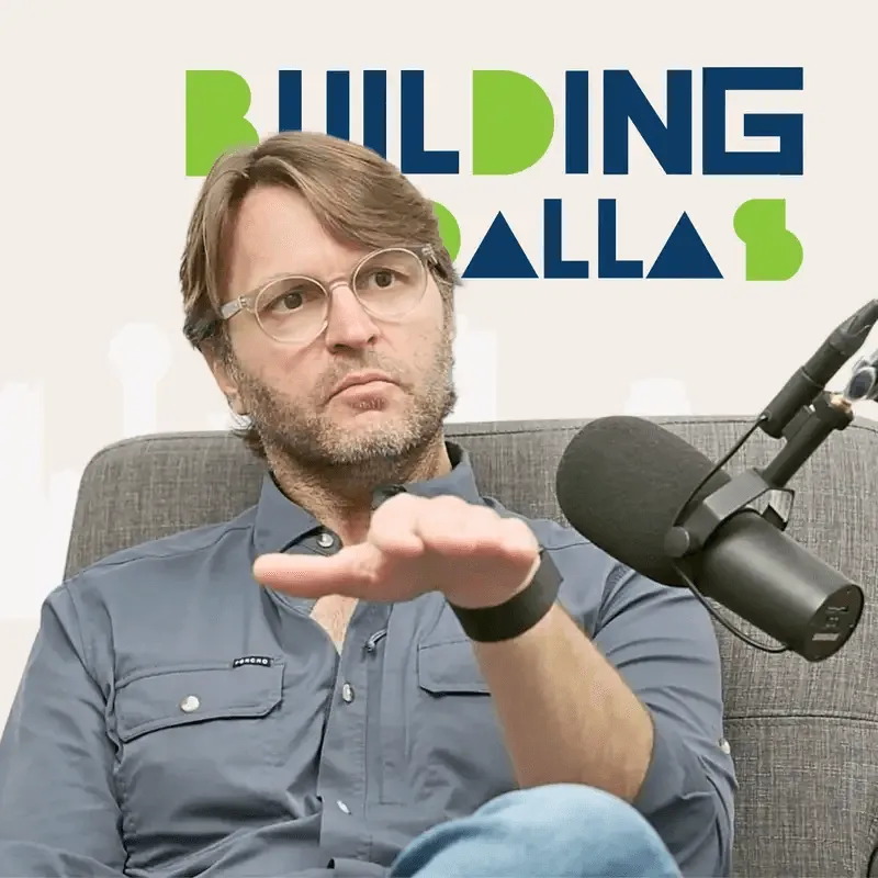 guest speaking into microphones with “Building Dallas” branding