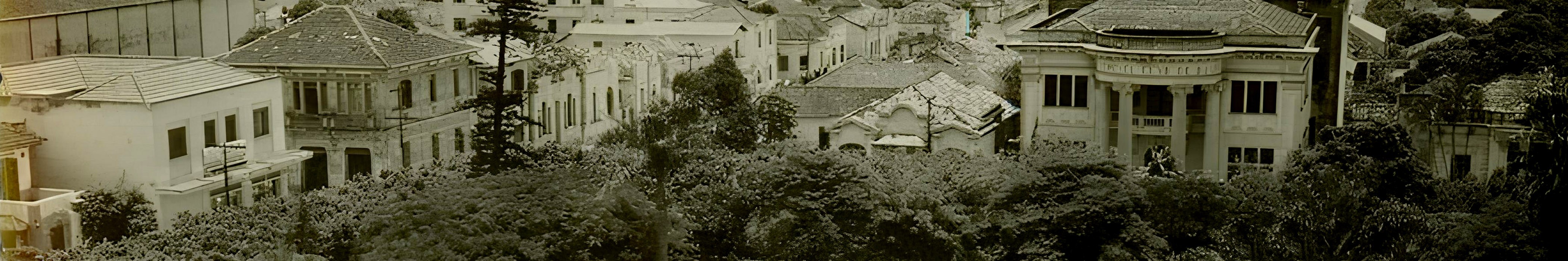 a black and white living room with a large tv