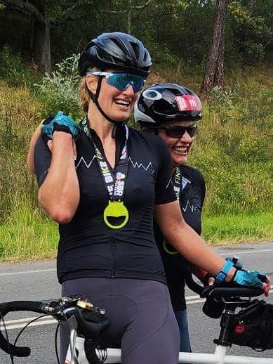 Lily and pilot Jay laughing and celebrating after their first 100km race in Port Stephens 