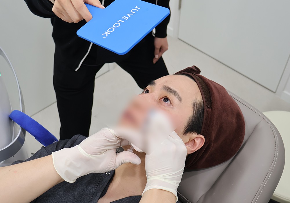Male patient receiving Juvelook facial injection treatment