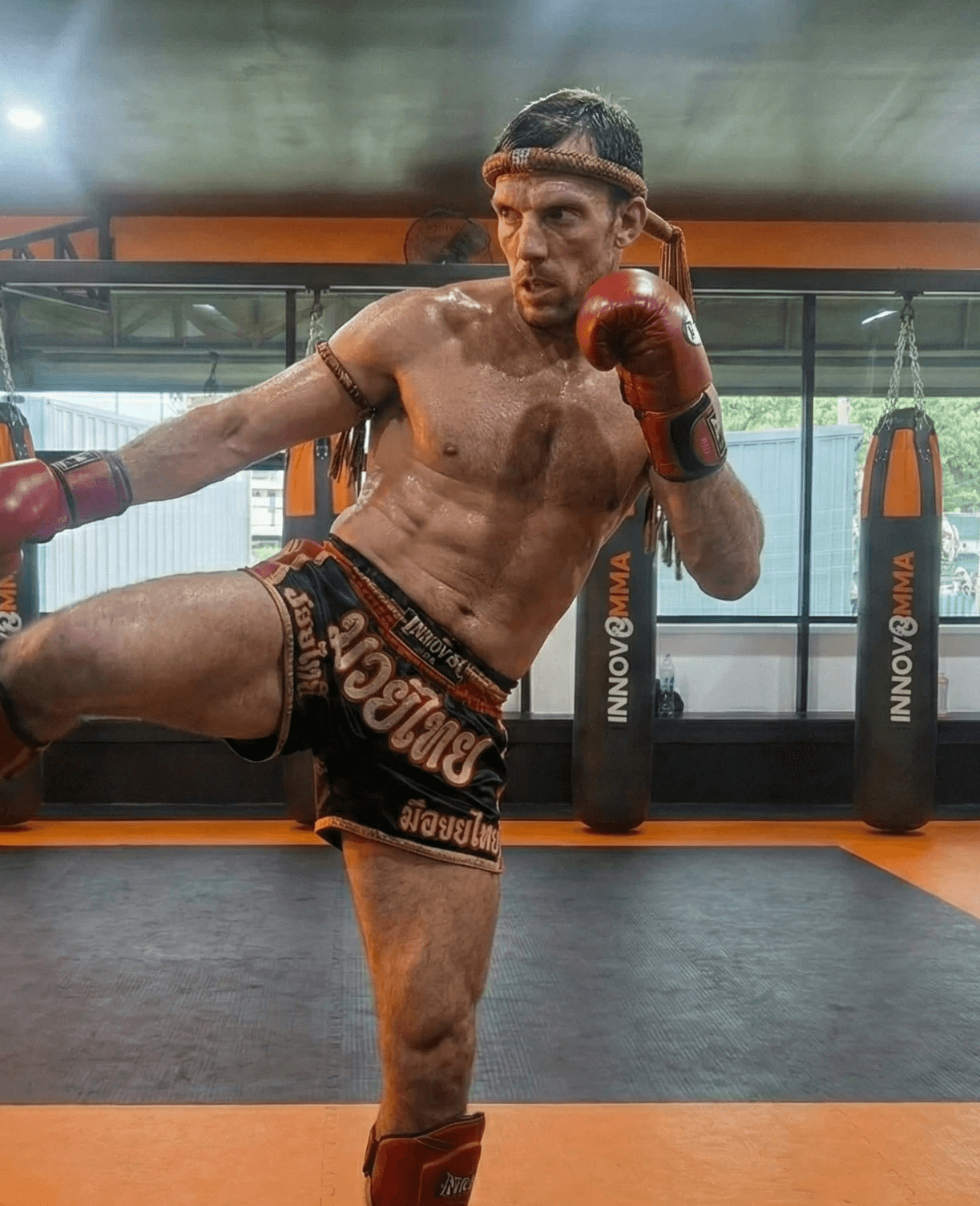 Muay Thai fighter in an action pose at INNOV8 MMA Gym