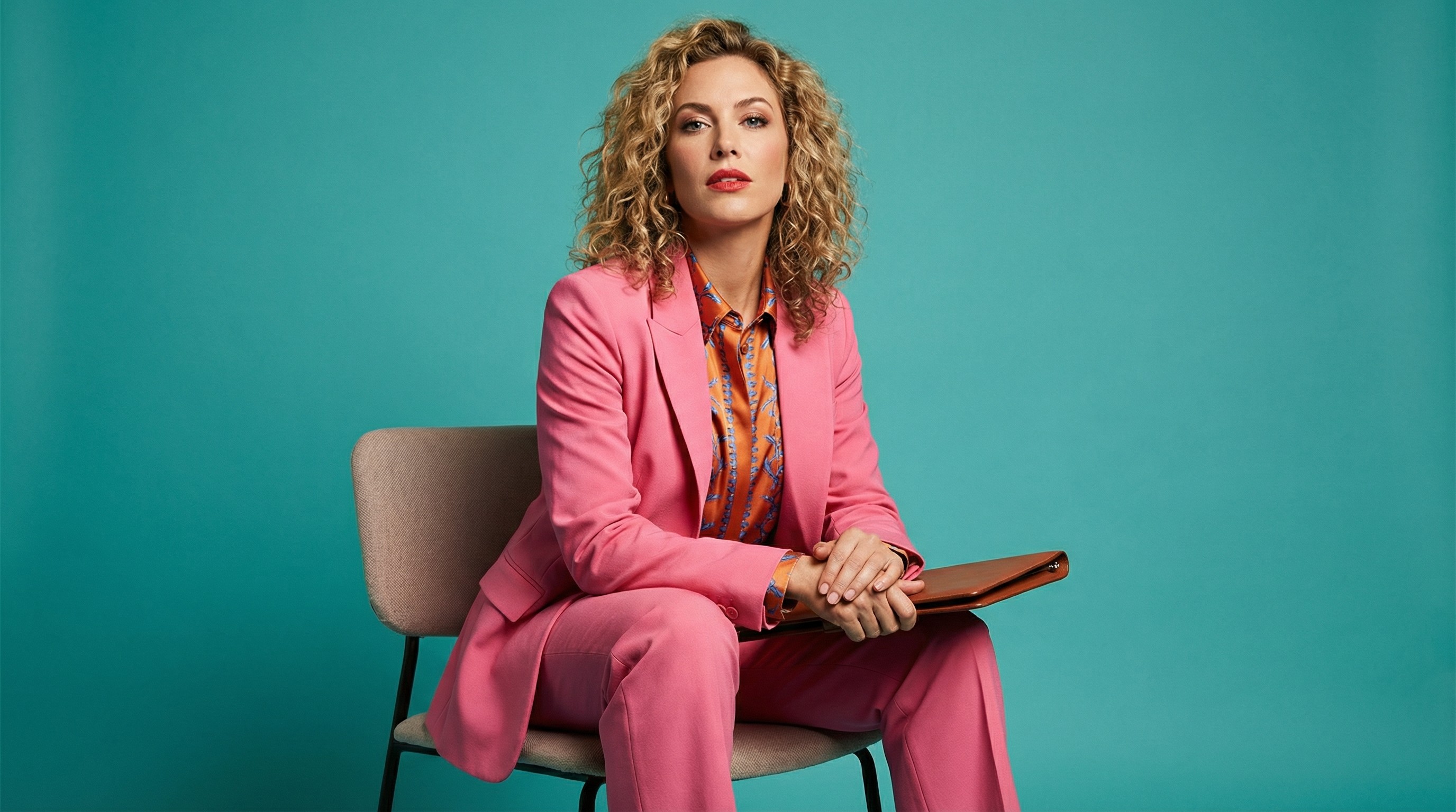Close-up of lush, dark green leaves, some glossy and wet, against a muted background.