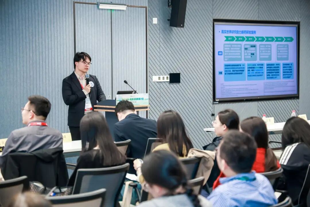 A blank white card resting on a softly draped rust-colored fabric atop a beige quilted surface.