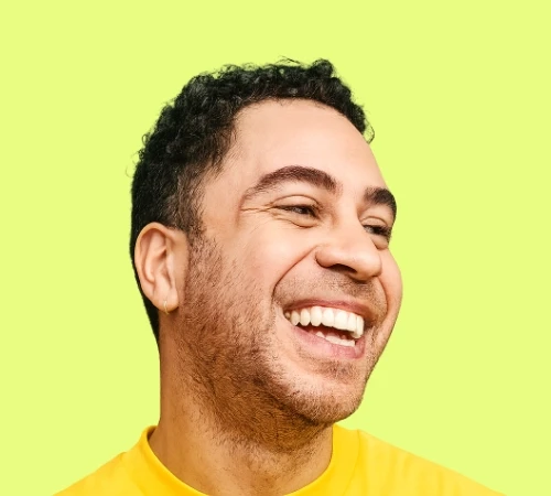 Man smiling user icon on a green background