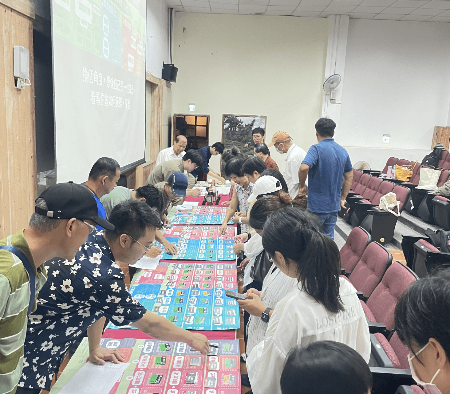 A man stading with Surfboard