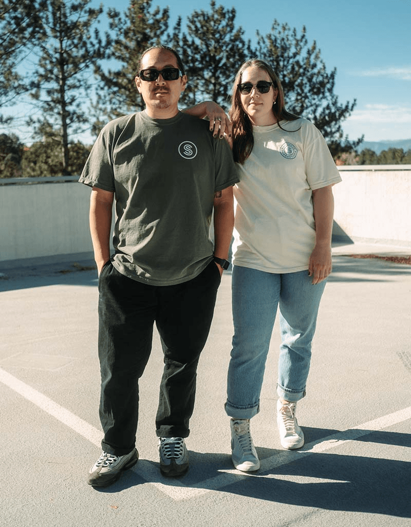 A man and woman modeling Soy Sauce Productions t-shirt merch