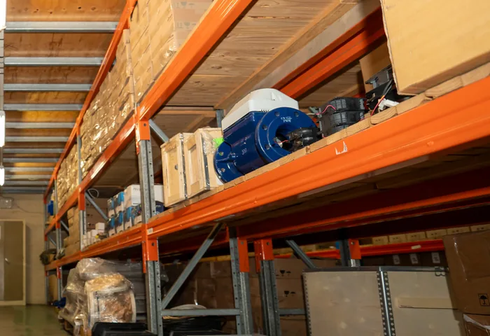 ABB motors and boxed equipment held in stock on the JOAT warehouse shelving