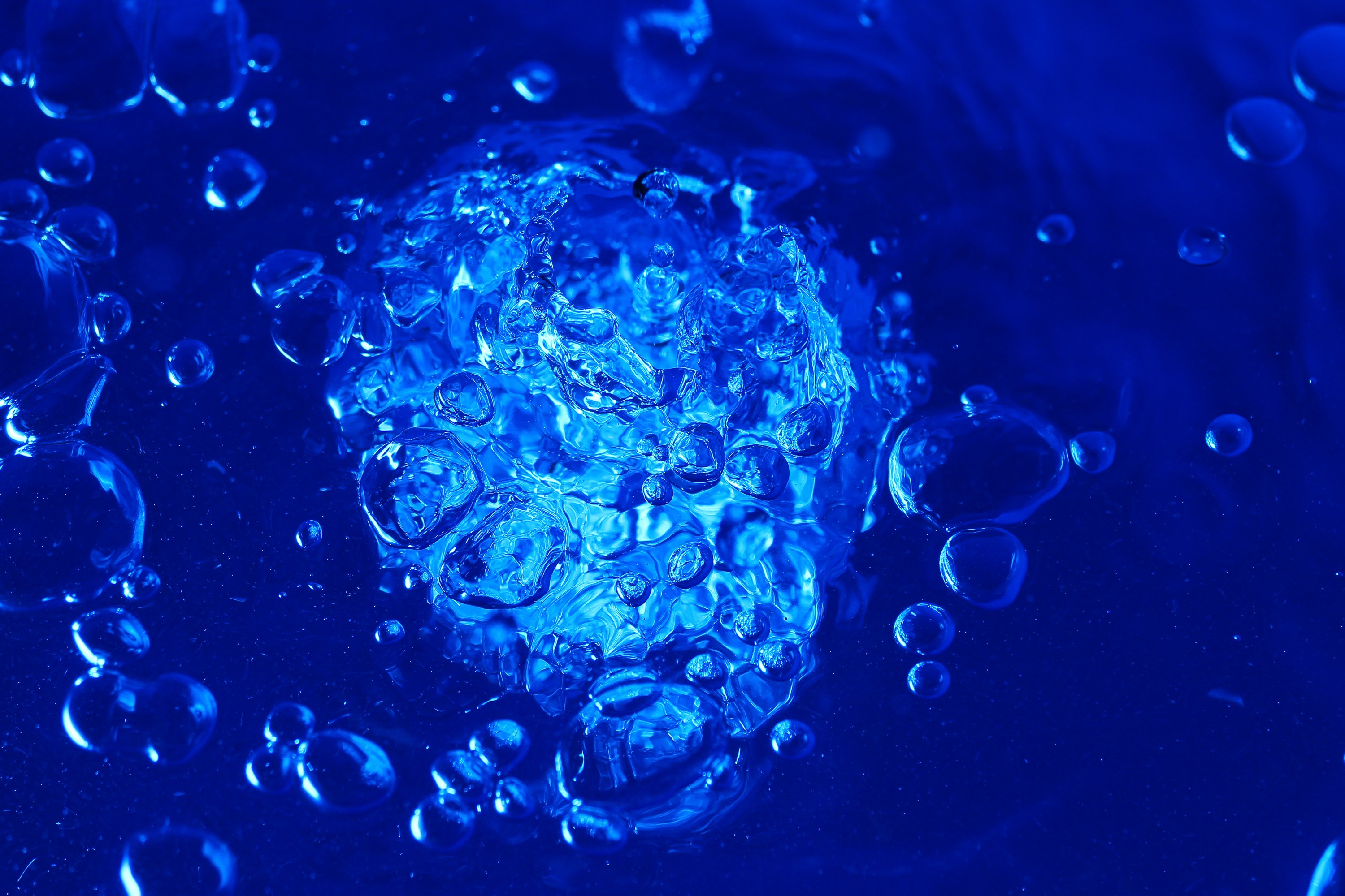 Close-up of a blue microscopic structure resembling a virus with detailed surface textures.