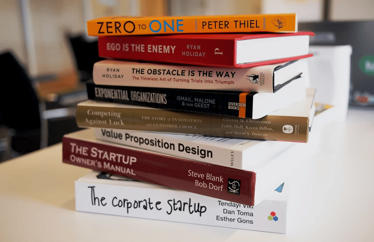 Business books stack — startup and valuation guides for founders and business owners