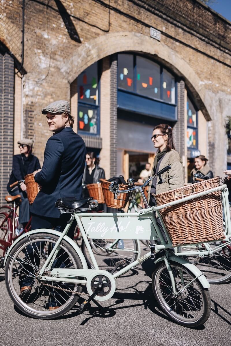 People getting ready for a London bike tour adventure on vintage bicycles 