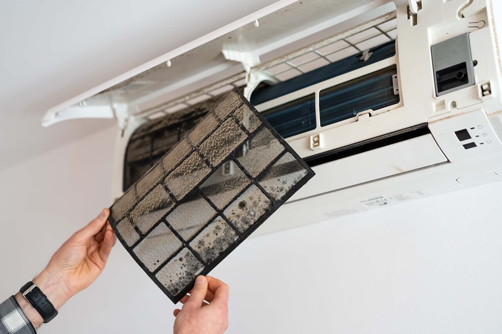 A dusty air filter is one of the reasons why air conditioners make noise when off by Adams Care