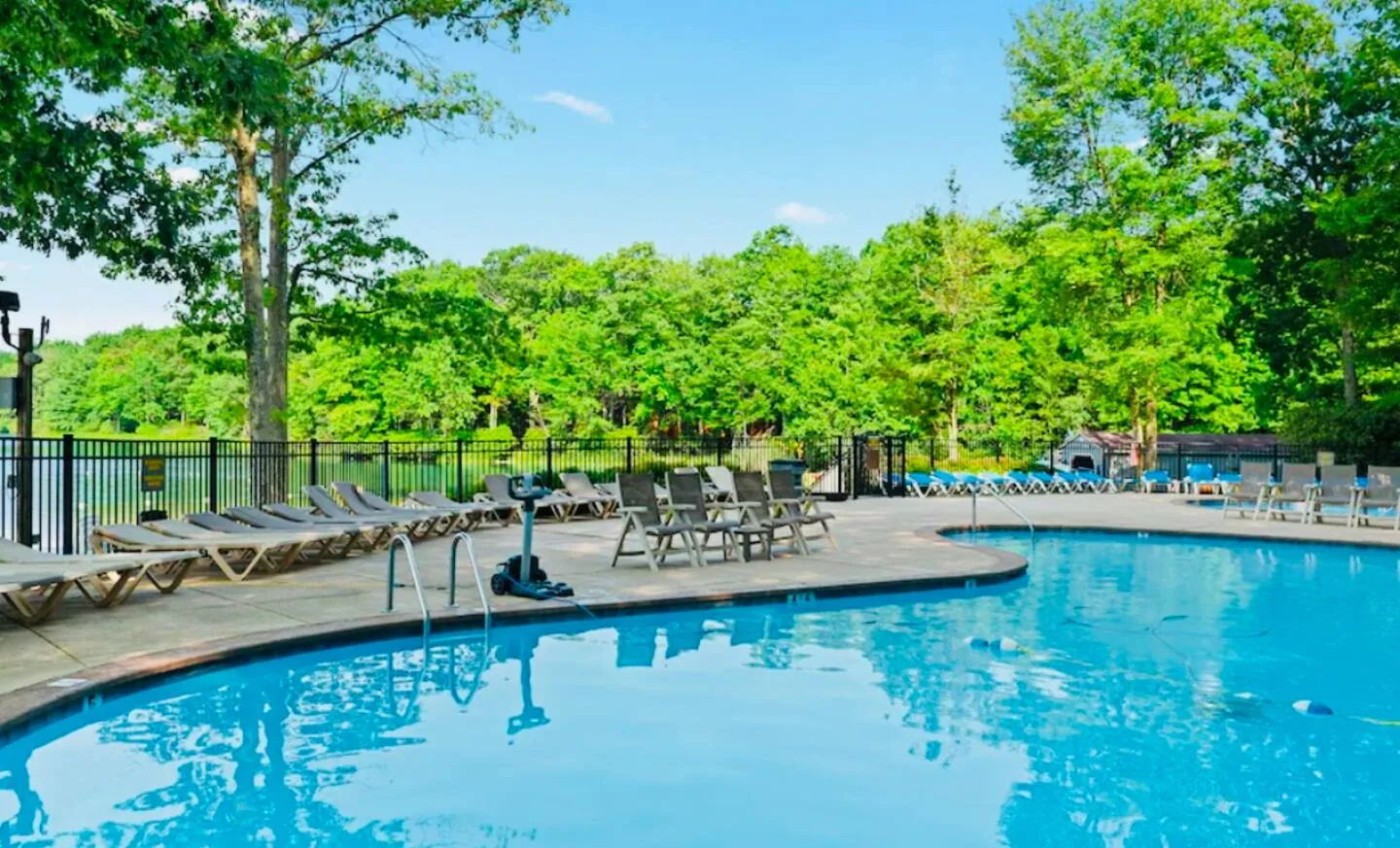 Boulder Lake Club outdoor pool with lounge chairs and trees, Big Boulder, Lake Harmony, PA