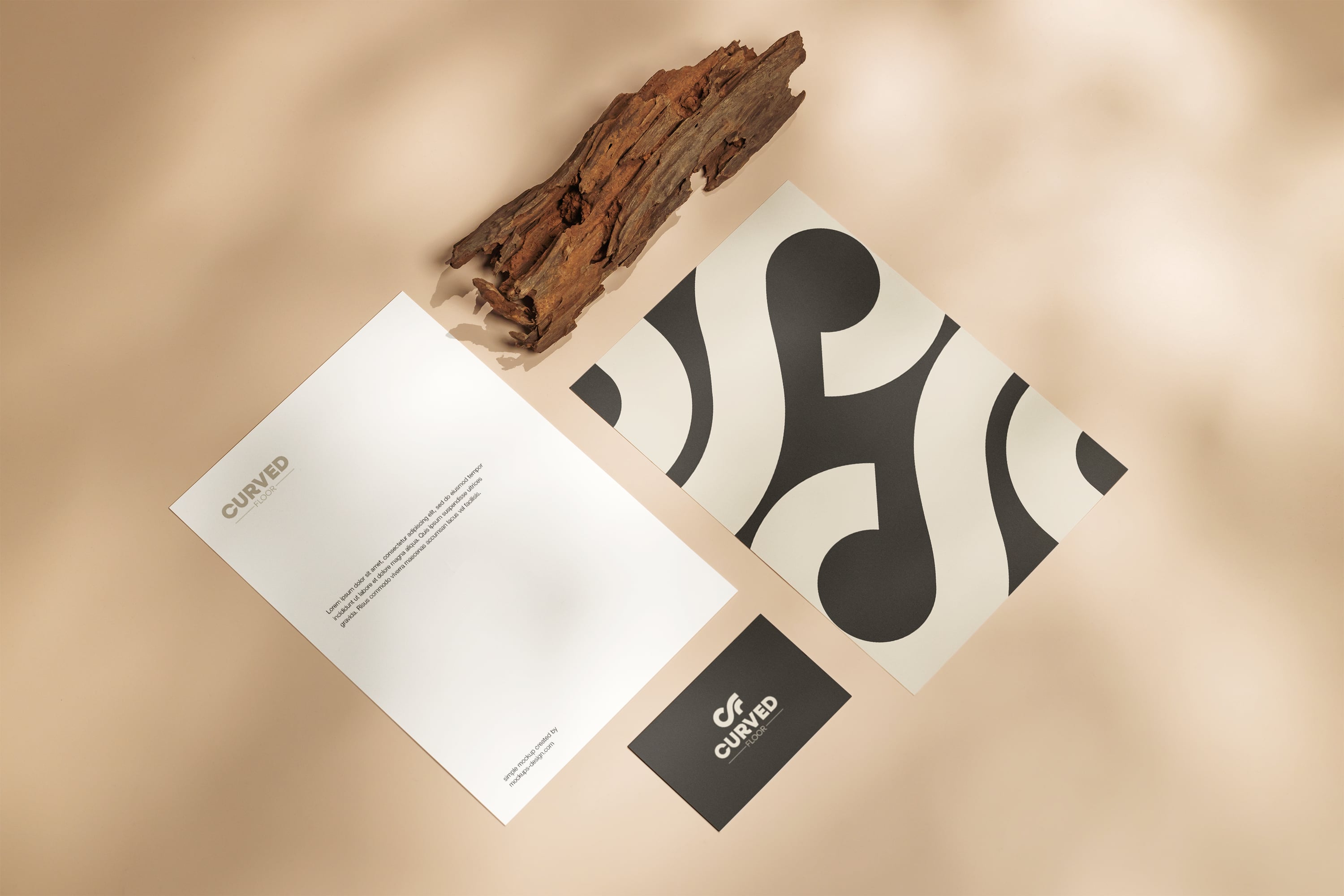 man wearing grey t-shirt standing in front of man sitting on chair