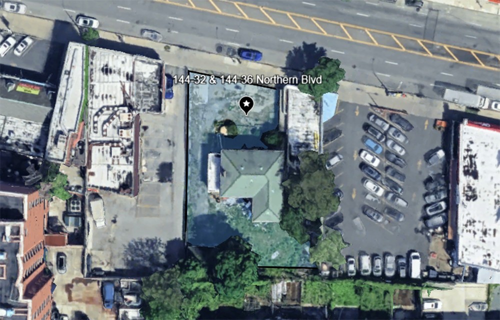 Tall modern skyscraper with vertical lines, viewed against a clear blue sky.