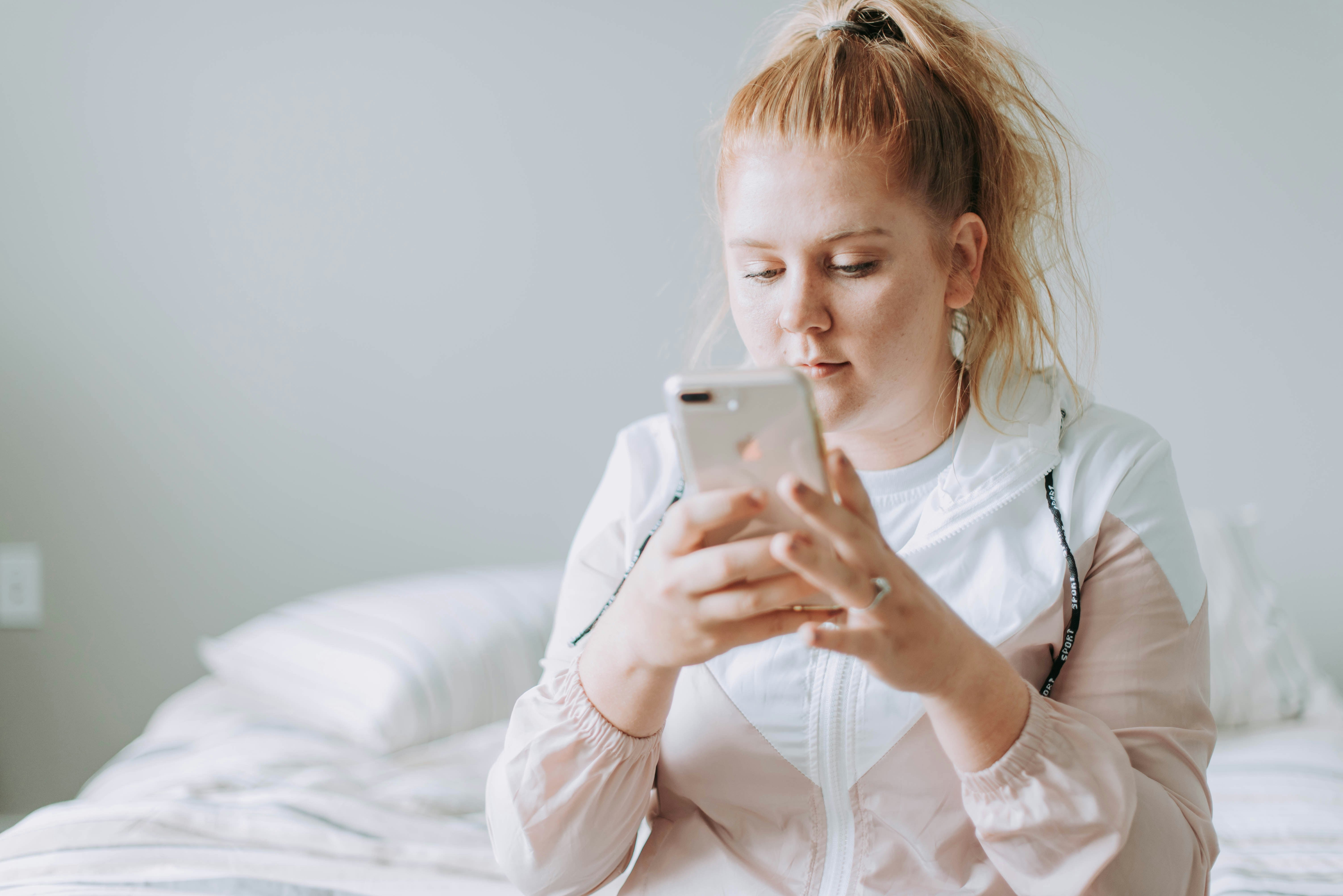 A female student using flashcards on their phone.