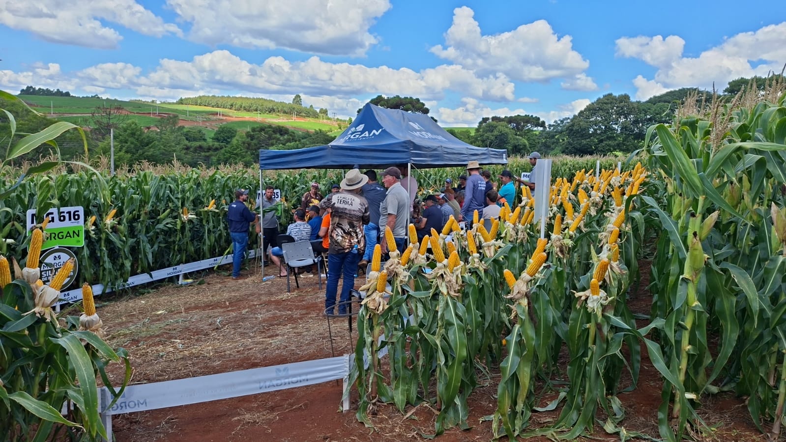 a couple of people standing next to a motorcycle