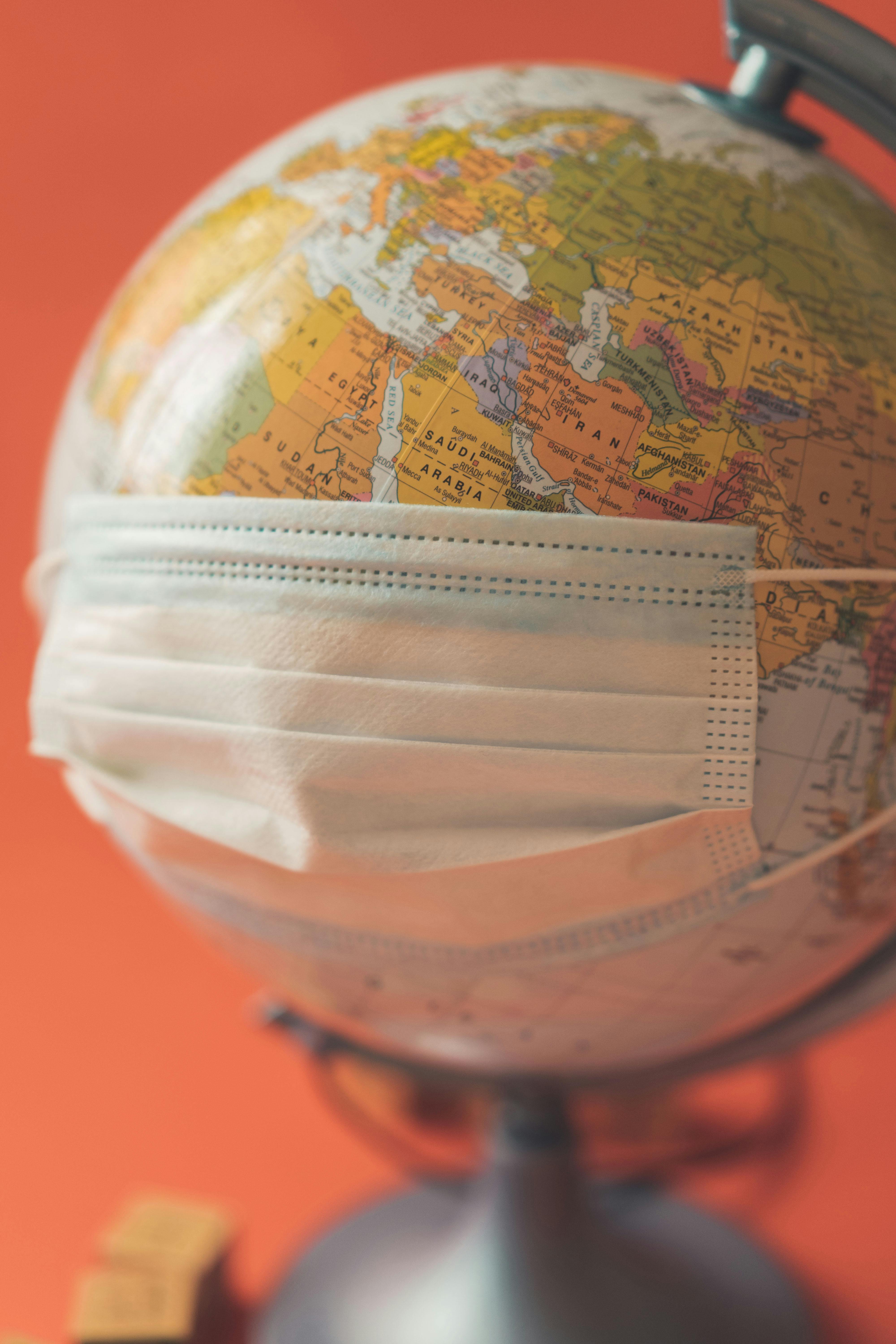 Globe with face mask