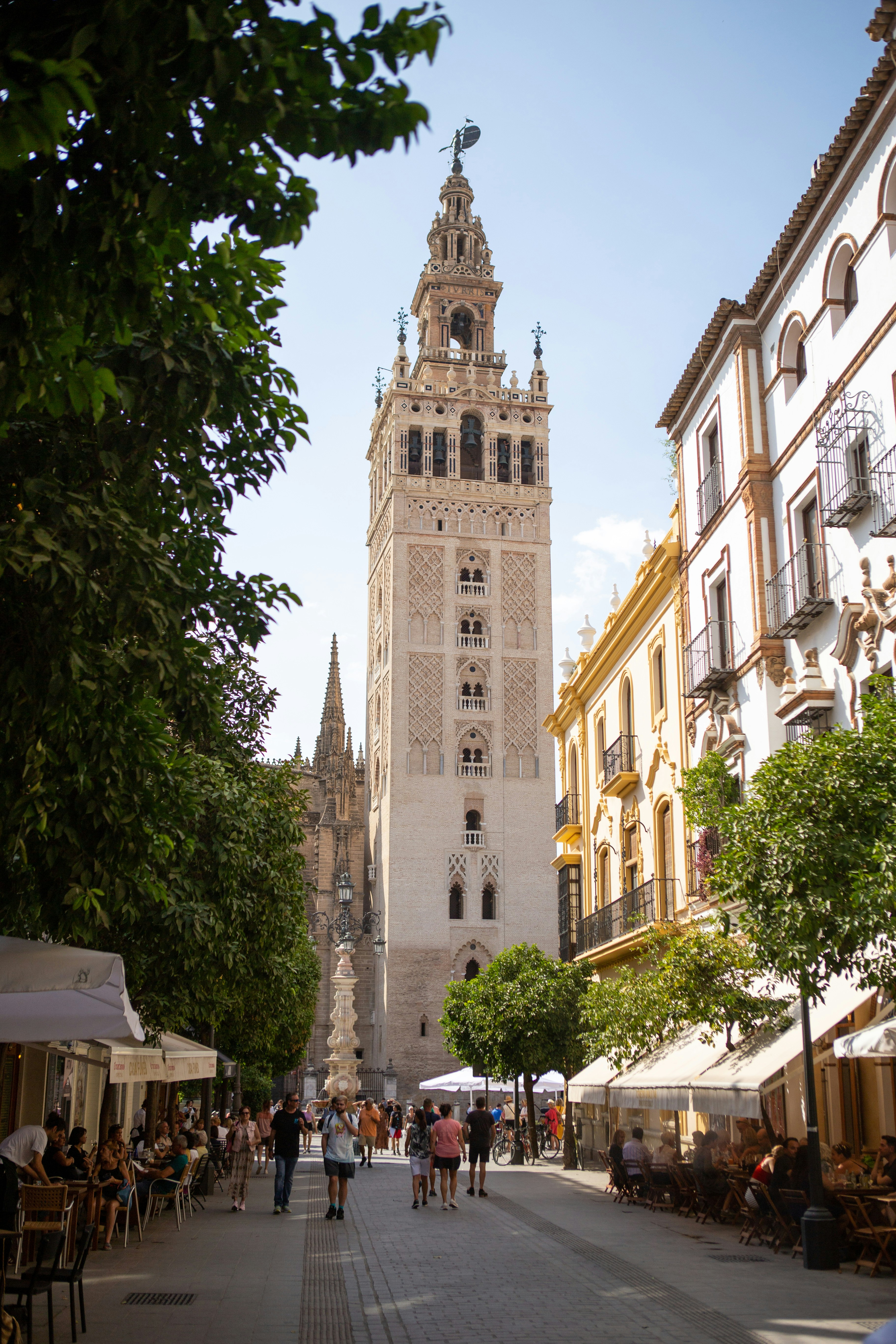 A tall clock tower towering over a city street