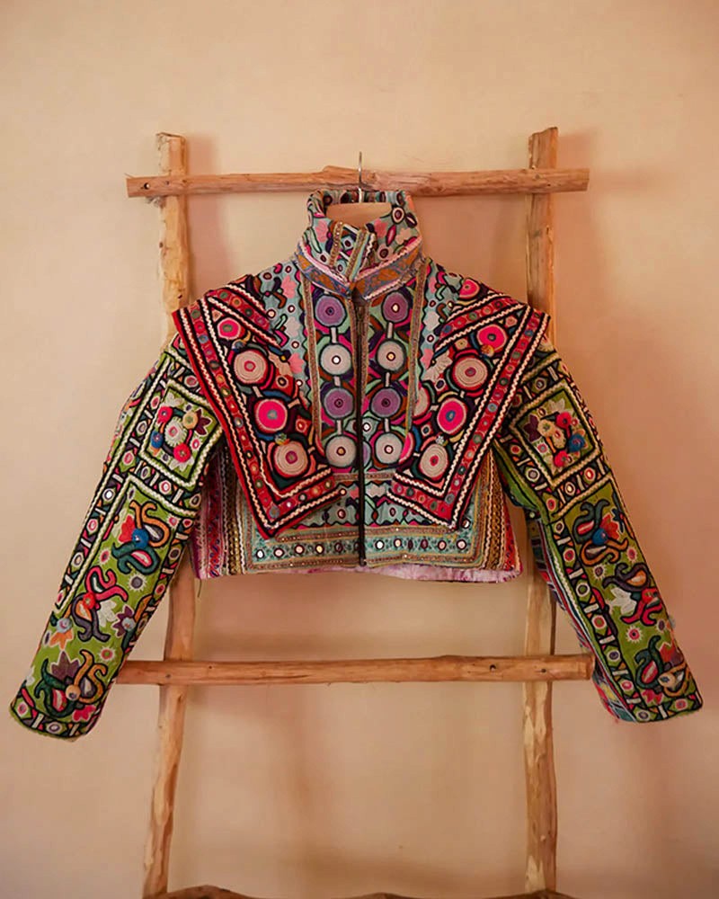 Chola No. II hand-embroidered jacket made from vintage Rabari Cholis with intricate threadwork, mirror detailing, and bold motifs in a contemporary silhouette.