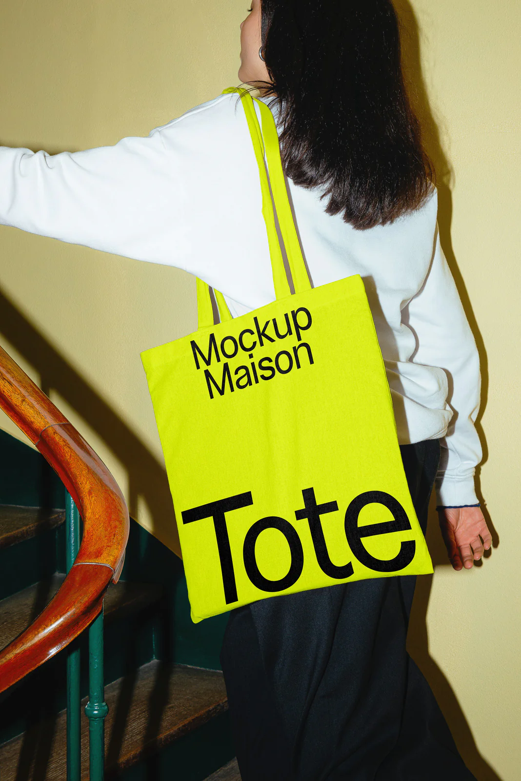 female carrying a tote bag